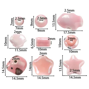 Detailed dimensions of mixed shape pink ceramic beads with cream texture for DIY