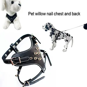 Close-up detail of black PU leather dog harness with sharp silver spikes and metallic buckles