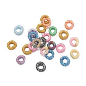 Detailed view of colorful metallic thread rings for DIY jewelry making and crafts