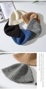 Close-up of multicolored knit bucket hats showing soft texture and various winter shades