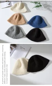 Detailed view of fuzzy alpaca wool bucket hats in various winter colors
