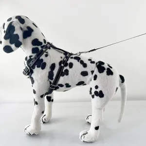 Detailed side view of black punk spiked dog harness on a dalmatian model