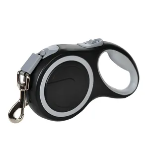 Side view of black retractable dog leash with grey anti-slip handle and metal clip