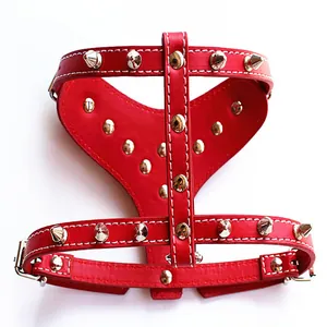 Detailed view of red punk studded leather dog harness featuring sharp silver spikes