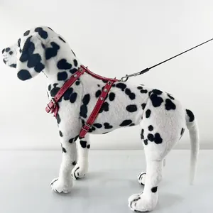 Detail of red punk style studded PU leather dog harness on a Dalmatian model