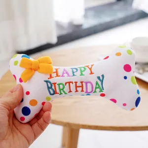 Jouet d'anniversaire en peluche pour chien en forme d'os avec des pois colorés et noeud