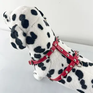 Red PU leather spiked dog harness with punk style studs on Dalmatian model