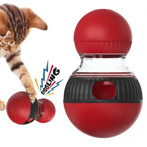 Interactive rotating cat toy treat dispenser ball with giggling sound and red finish
