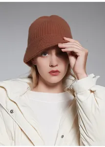 Close-up of a model wearing a brown thickened pure wool knitted bucket hat for winter.