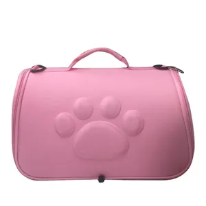 Portable pink EVA pet carrier bag for cats and dogs with embossed paw print design