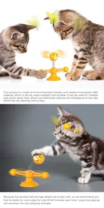 Detail view of cats playing with a yellow spring-loaded suction cup toy with feathers