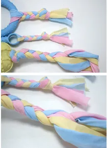 Macro detail of durable macaron-colored braided cotton fabric strips for pet toys