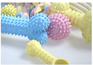 Detailed close-up view of colorful TPR dog chew toys with spikes for tooth cleaning.