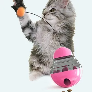 Interactive pink cat treat dispenser tumbler toy with bouncy teaser ball for kittens