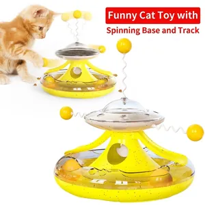 Interactive yellow tumbler cat toy with spinning balls and food dispenser feature
