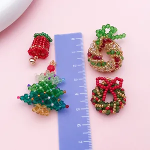 Handmade beaded Christmas tree and wreath charms shown with ruler for size reference