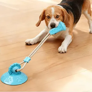 Juguete de ventosa duradero para mascotas con hueso azul en un suelo de madera clara