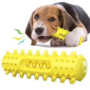 Giocattolo da masticare sonoro resistente per cani e spazzolino in gomma gialla.