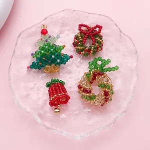 Detailed view of hand-woven Christmas tree, wreath, and bell crystal bead pendants