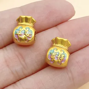 Macro view of gold alloy lucky bag beads with colorful enamel and Chinese characters