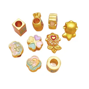 Gold alloy charms set with lucky carp, clover, and Chinese blessing characters