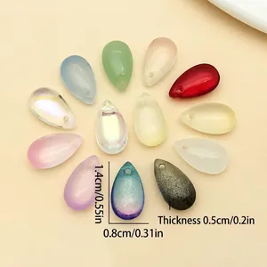Close-up of various colorful iridescent teardrop glass beads with precise dimension markings.