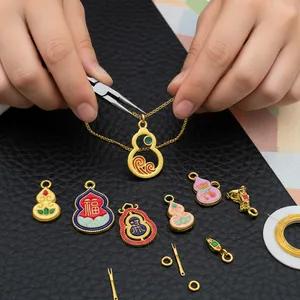 Detailed macro view of DIY gold gourd pendants with enamel Fu character and lotus patterns