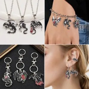 Detailed view of dark gothic dragon jewelry set including necklaces and earrings
