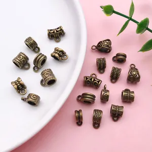 Detailed view of assorted antique bronze retro pattern spacer beads for DIY jewelry