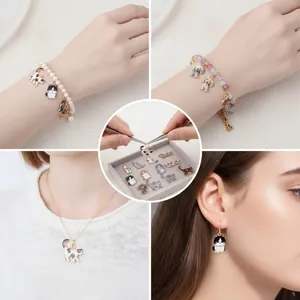 Detailed view of colorful enamel cat and dog charms used in bracelets and earrings
