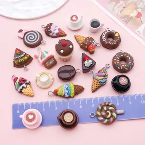 Macro view of chocolate-themed resin food charms with a ruler for size reference.