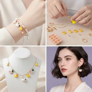 Collage of farm animal jewelry featuring duck and goose charms on necklaces and earrings.