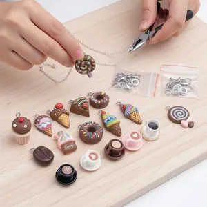 Close-up of chocolate-themed resin charms being assembled into a DIY necklace