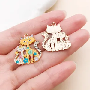 Detailed view of handmade floral enamel cat charms for DIY bracelet and earring making