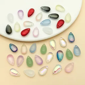 Detailed view of colorful iridescent teardrop glass beads for DIY jewelry making pendants