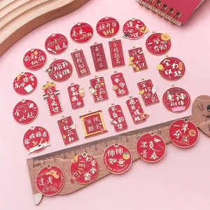 Close-up of assorted red alloy pendants with Chinese graduation blessing characters