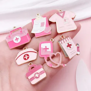 Detailed view of assorted pink medical-themed enamel charms for jewelry making DIY