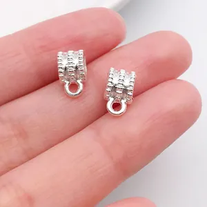 Detailed view of silver vintage pattern bail beads for DIY necklace and bracelet.