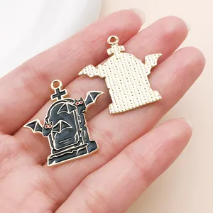 Macro view showing the front and back of Gothic tombstone pendants with bat wings