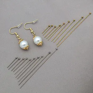 Detailed macro view of gold and silver stainless steel ball head pins for DIY jewelry making