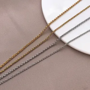 Close-up detail of high-quality woven stainless steel chain necklaces in gold and silver