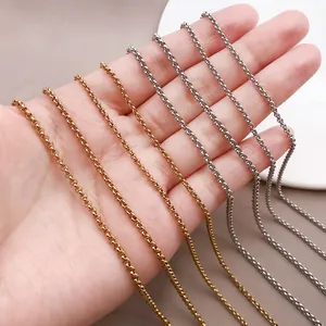 Detailed view of high-quality woven stainless steel chains in gold and silver finishes.