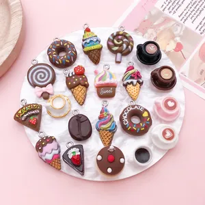 Close-up of chocolate-themed resin charms featuring donuts, ice cream, and cakes