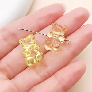Transparent acrylic gummy bear charms for DIY jewelry making in yellow and orange colors.