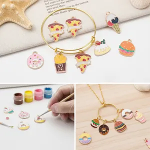 Detail view showing DIY enamel food pendants and the painting process for jewelry