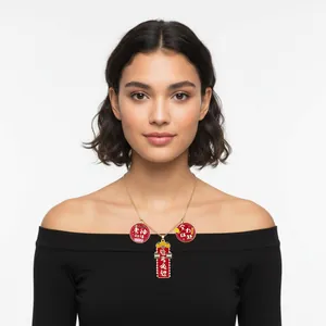 Detailed view of red alloy charms necklace featuring Chinese exam blessing text