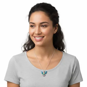 Model wearing a colorful hummingbird pendant necklace with intricate wing detail