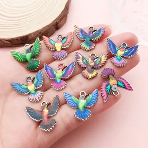 Close-up detail of vibrant multicolor printed hummingbird charms for DIY jewelry making