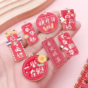 Close-up of red enamel DIY alloy pendants with Chinese graduation and exam blessing text
