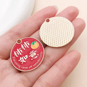 Macro view of red enamel good luck pendant with 'Everything came off satisfactorily' text